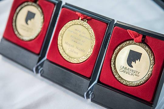 Communications Professional Earns Medal for Academic Excellence
