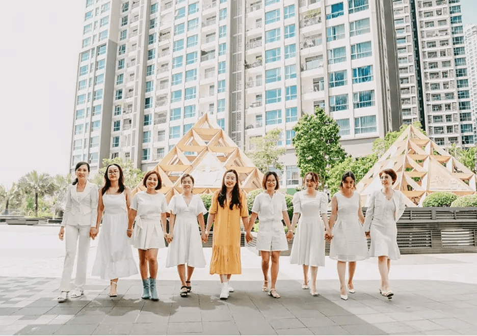 women-collaborating-holding-hands