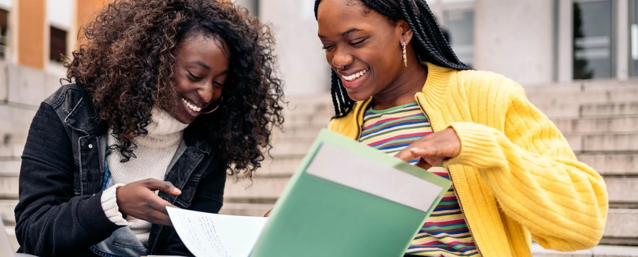 two students reviewing notes